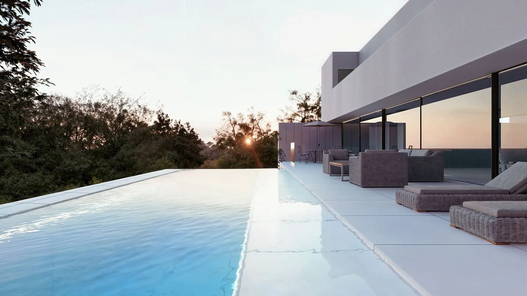 White villa with an infinity pool open to the forest