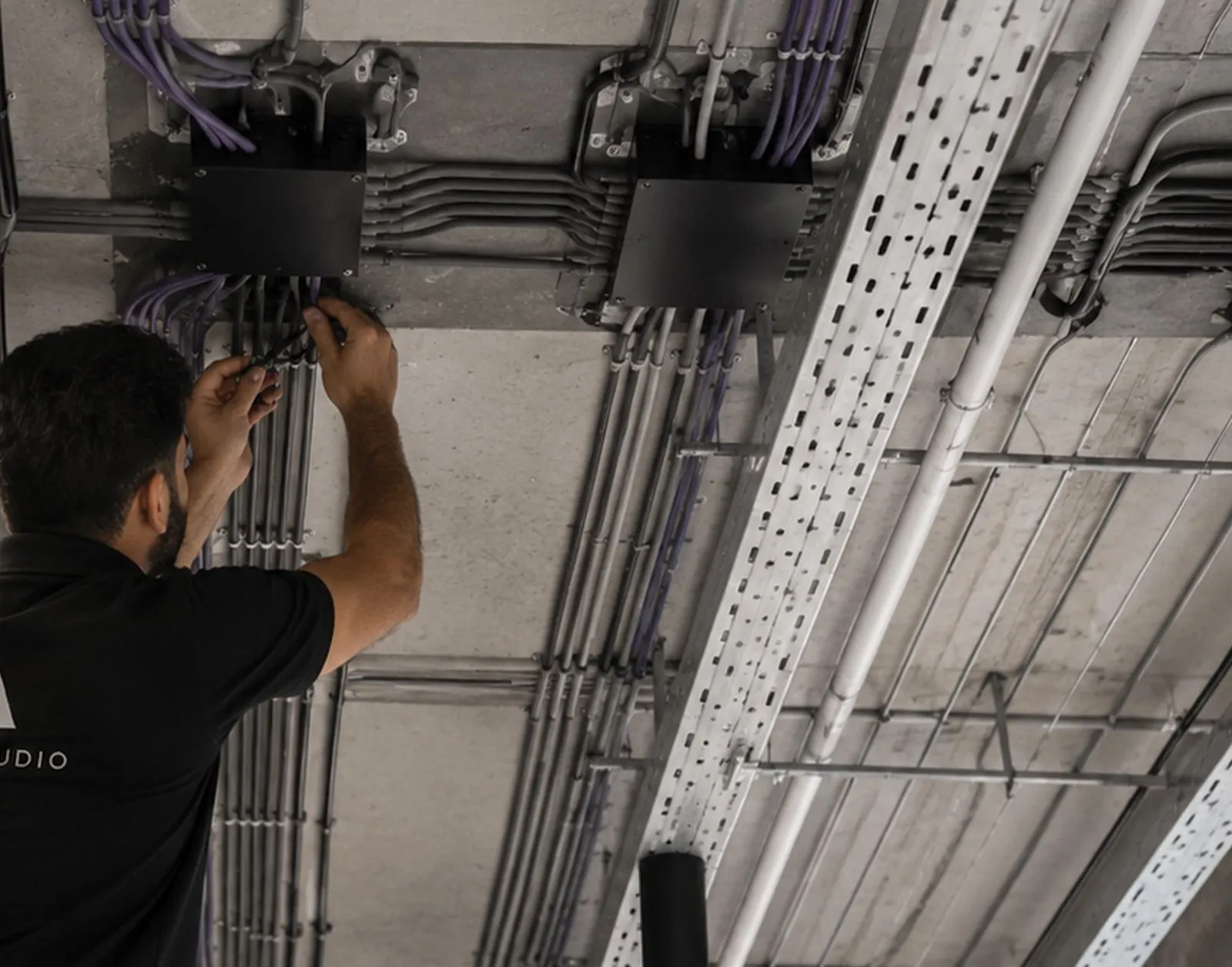 Electrician working on cable trays